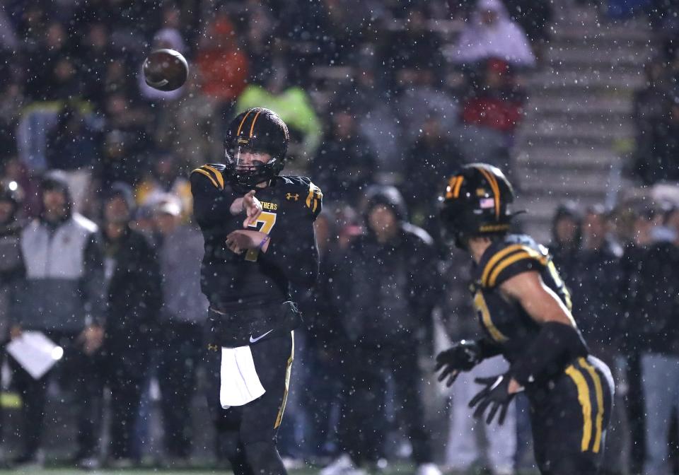 Newbury Park quarterback Brady Smigiel throws a pass to Shane Rosenthal during the third quarter of the Panthers' 22-19 win over Thousand Oaks in a CIF-SS Division 5 semifinal game on Nov. 17.