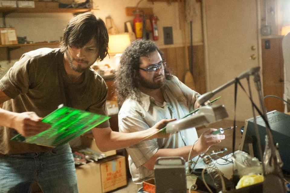 This film image released by Open Road Films shows Ashton Kutcher as Steve Jobs, left, and Josh Gad as Steve Wozniak in a scene from "Jobs." (AP Photo/Open Road Films, Glen Wilson)