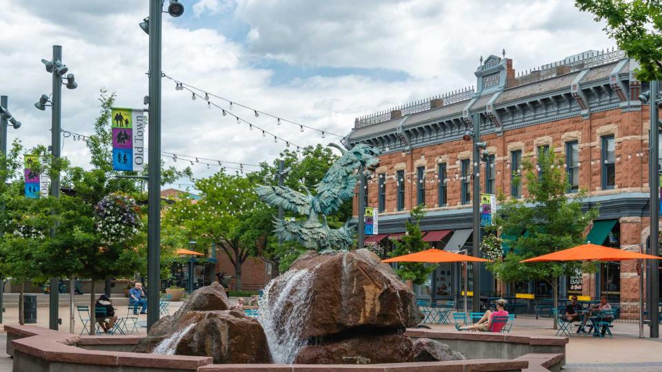 People relaxing in the quaint Old Town section of Fort Collins, Colorado.