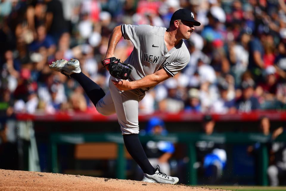 Jul 19, 2023; Anaheim, California, USA; New York Yankees starting pitcher Carlos Rodon (55) throws against the Los Angeles Angels during the third inning at Angel Stadium. Mandatory Credit: Gary A. Vasquez-USA TODAY Sports