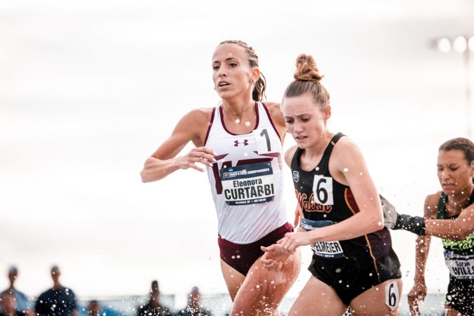 Eleonora Curtabbi runs next to another competitor at the 2022 NCAA Division II Outdoor Championships.