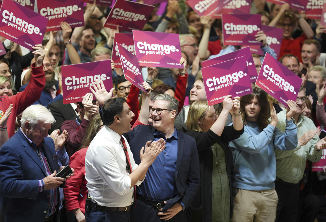 Britain's Labour Party leader Sir Keir Starmer, center, reacts after giving a speech during a visit to the Caledonian Gladiators Stadium in East Kilbride, Scotland, Wednesday July 3, 2024, while on the General Election campaign trail. (Andrew Milligan/PA via AP)