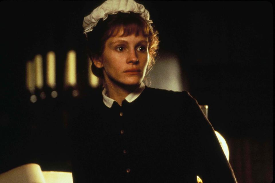 Close-up of Julia in a housekeeper uniform