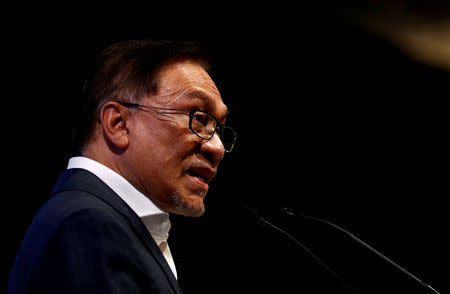 FILE PHOTO: Malaysian politician Anwar Ibrahim speaks during the Singapore Summit in Singapore, September 15, 2018. REUTERS/Edgar Su/File Photo
