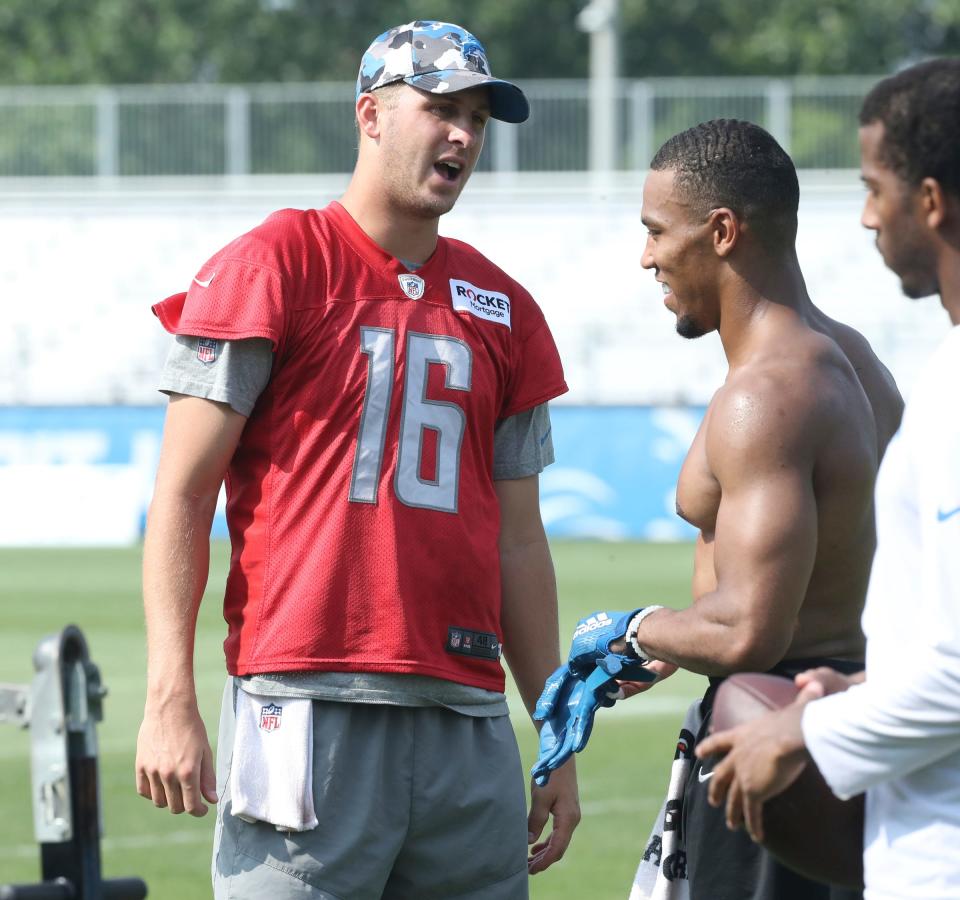 Lions quarterback Jared Goff, left, talks with wide receiver Amon-Ra St. Brown after training camp on Wednesday, July 26, 2023, in Allen Park.