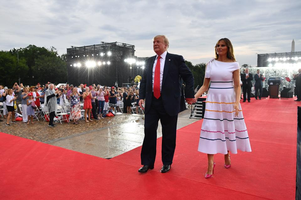 US President Donald Trump (L) and First Lady Melania Trump leave after attending the "Salute to America" Fourth of July event at the Lincoln Memorial in Washington, DC, July 4, 2019. (Photo by MANDEL NGAN / AFP)        (Photo credit should read MANDEL NGAN/AFP/Getty Images)