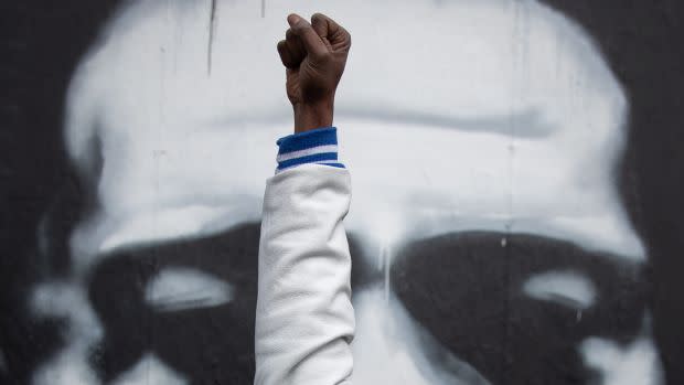 Resident raises fist in reaction to verdict in the trial of former Minneapolis police officer Derek Chauvin