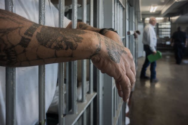 A prisoner's hands are seen inside a punishment cell wing at the Louisiana State Penitentiary in Angola, Oct. 14, 2013. (Photo: Giles Clarke via Getty Images)