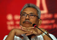 Sri Lankan presidential candidate and former defense chief Gotabaya Rajapaksa sits during a news conference in Colombo, Sri Lanka, Tuesday, Oct. 15, 2019. Rajapaksa, who's a front-runner in next month's presidential election says if he wins he won't recognize an agreement the government made with the U.N. human rights council to investigate alleged war crimes during the nation's civil war. (AP Photo/Eranga Jayawardena)