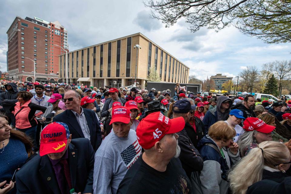 Trump supporters wait in line at a Make America Great Again Rally where former US President Donald Trump is scheduled to speak in Manchester, New Hampshire on April 27, 2023.