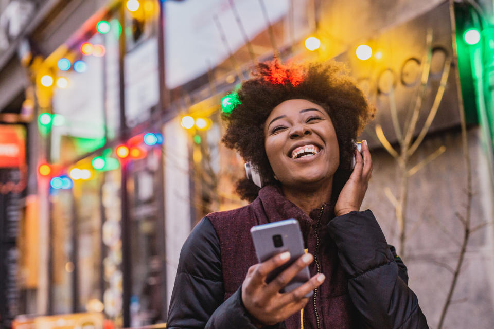 GettyImages 1273370190 Zodiac Signs as Christmas Music—Which Song Captures Your Holiday Spirit?