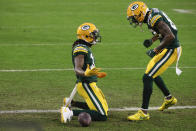Green Bay Packers' Davante Adams, left, celebrates after scoring with Marquez Valdes-Scantling after a touchdown during the first half of an NFL divisional playoff football game against the Los Angeles Rams, Saturday, Jan. 16, 2021, in Green Bay, Wis. (AP Photo/Matt Ludtke)
