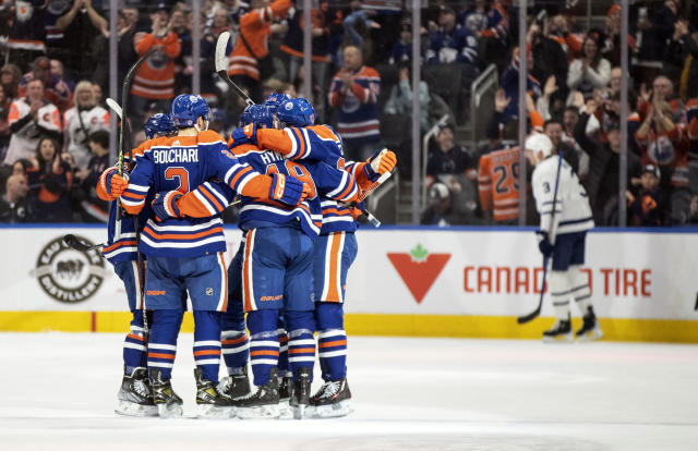 Edmonton Oilers' Warren Foegele (37) and Klim Kostin (21) celebrate a goal  against the Toronto Maple Leafs during the second period of an NHL hockey  game, Wednesday, March 1, 2023 in Edmonton