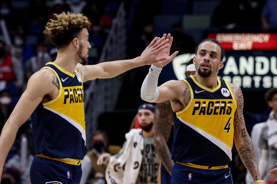 Jan 24, 2022; New Orleans, Louisiana, USA; Indiana Pacers guard Duane Washington Jr. (4) congratulates guard Chris Duarte (3) after a play aghast the New Orleans Pelicans during the second half at the Smoothie King Center. Mandatory Credit: Stephen Lew-USA TODAY Sports