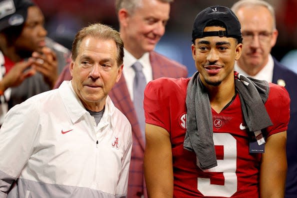 Head coach Nick Saban and quarterback Bryce Young #9 of the Alabama Crimson Tide celebrate their win against the Georgia Bulldogs in the SEC Championship game at Mercedes-Benz Stadium on December 04, 2021 in Atlanta, Georgia.