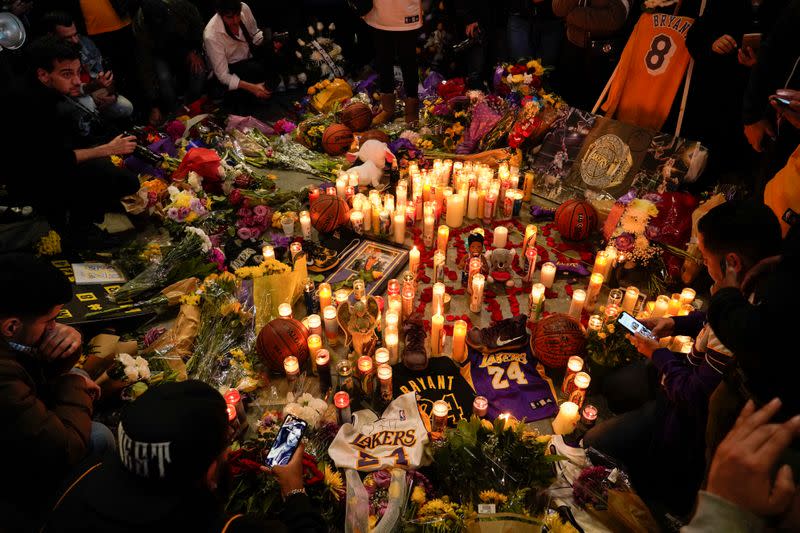 Mourners gather in Microsoft Square near the Staples Center to pay respects to Kobe Bryant after a helicopter crash killed the retired basketball star, in Los Angeles