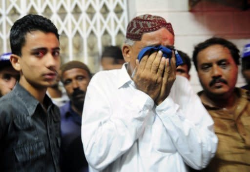 Relatives mourn the killing of politician Waja Karimdad who was shot dead by a criminal gang in Karachi. Violence between ethnic groups and criminal gangs killed 39 people in Pakistan's financial capital of Karachi, police said Thursday, as the government again struggled for solutions to the unrest