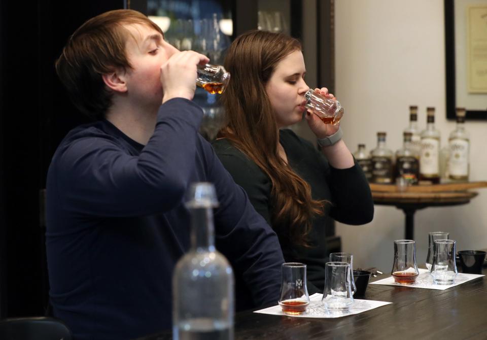 Kristen McMaster and Robert Cherry, both of Dublin, try a sample of Middle West Spirits' Michelone Reserve bourbon whiskey  Jan. 15.