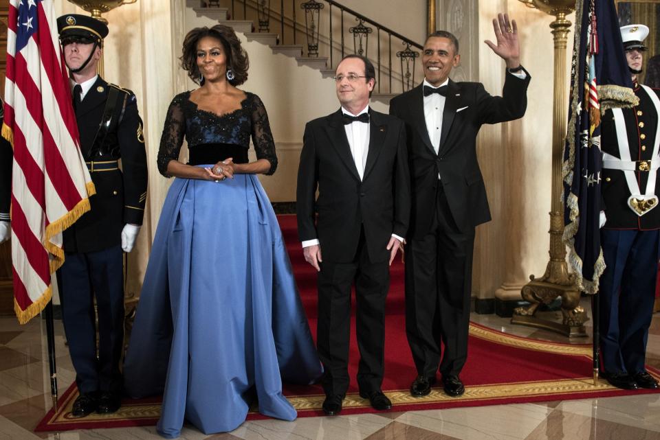 <p>Le 12 février 2014, Michelle Obama porte une robe Carolina Herrera lors du dîner en l'honneur du président François Hollande. (AFP)</p>