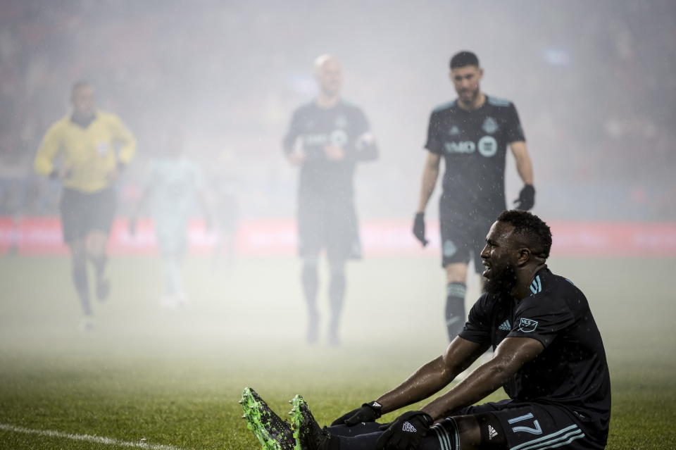 Toronto FC forward Jozy Altidore (17) recovers on the ground after being tackled during the second half against Minnesota United during an MLS soccer match in Toronto on Friday, April 19, 2019.(Christopher Katsarov/The Canadian Press via AP)