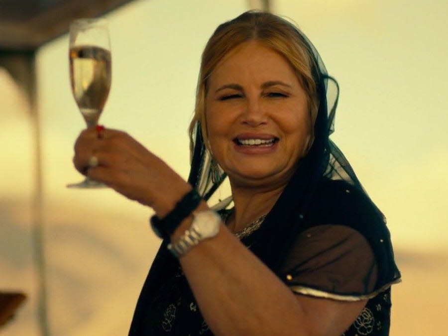 Jennifer Coolidge with white wine