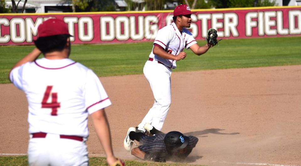 Golden Valley High third baseman Sebastian Gonzalez (10) tags out El Capitan’s Braylen Centeno (2) during a baseball game at Doug Fister Field on Tuesday, March 26, 2024.