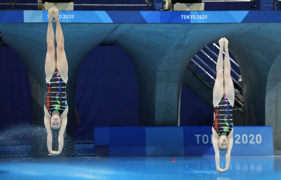 Lena Hentschel and Tina Punzel of Germany compete during the Women's Synchronized 3m Springboard Final at the Tokyo Aquatics Centre at the 2020 Summer Olympics, Sunday, July 25, 2021, in Tokyo, Japan. (AP Photo/Dmitri Lovetsky)