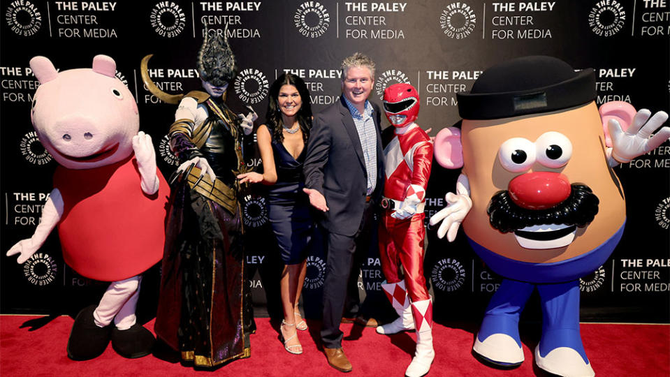 The Paley Center President & CEO Maureen J. Reidy 3rd L and Hasbro President and CEO Chris Cocks 3rd R pose with Peppa Pig, Red Power Ranger, and Mr. Potato Head during The Paley Honors A Gala Tribute To Hasbro's Centennial at Cipriani 42nd Street on October 23, 2023 in New York City.