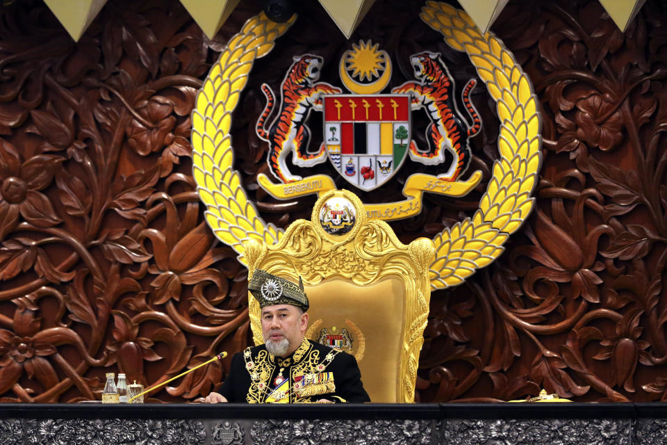 FILE - In this July 17, 2018, file photo, Malaysian King Sultan Muhammad V delivers the opening speech at the 14th parliament session at the Parliament House in Kuala Lumpur, Malaysia. Sultan Muhammad V shocked the nation by announcing his abdication in January 2019, days after returning from two months of medical leave. The 49-year-old sultan from eastern Kelantan state only reigned for two years as Malaysia's 15th king and didn't give any reason for quitting. (AP Photo/Yam G-Jun, File)