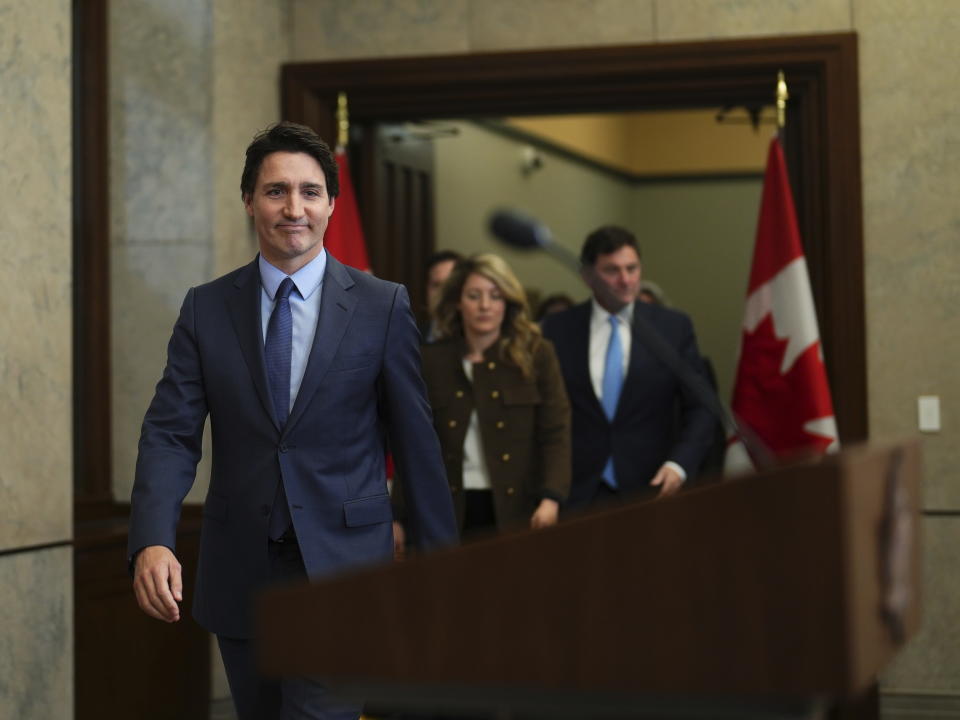 Canada's Prime Minister Justin Trudeau makes his way to the podium for a news conference on Parliament Hill in Ottawa, Ontario, on Monday, March 6, 2023. Trudeau said he will appoint a special investigator to decide whether there should be a public inquiry into reports of Chinese interference in Canada's elections. (Sean Kilpatrick/The Canadian Press via AP)