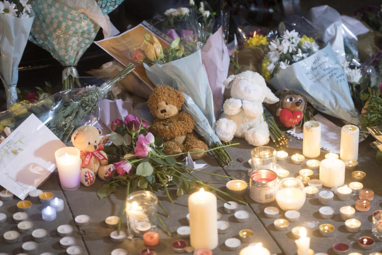 Tributes: flowers, candles and toys left at a vigil in Manchester: Jeremy Selwyn