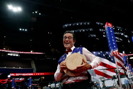 CBS television comedian Stephen Colbert poses for the camera on the floor of the Republican National Convention in Cleveland, Ohio, U.S. July 17, 2016. REUTERS/Mark Kauzlarich