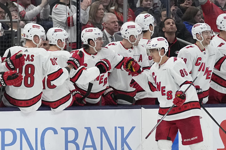 Carolina Hurricanes left wing Teuvo Teravainen (86) is congratulated by teammates after his goal against the Columbus Blue Jackets during the second period of an NHL hockey game Thursday, Feb. 29, 2024, in Columbus, Ohio. (AP Photo/Sue Ogrocki)