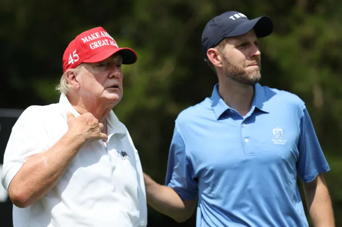 Former U.S. President Donald Trump and Eric Trump wait together during the pro-am prior to the LIV Golf Invitational - Bedminster at Trump National Golf Club Bedminster on July 28, 2022 in Bedminster, New Jersey
