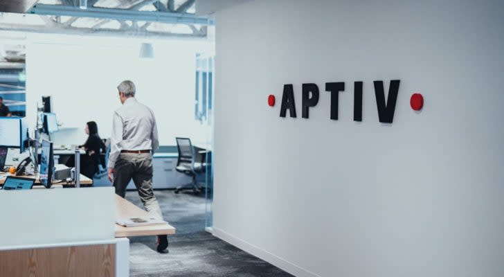 Aptiv corporate location with logo against white wall.
