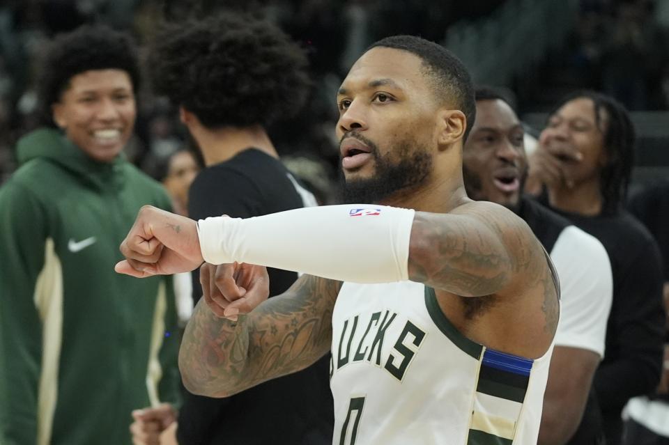 Milwaukee Bucks' Damian Lillard reactsf after making the game-winning three pointer in overtime of an NBA basketball game against the Sacramento Kings Sunday, Jan. 14, 2024, in Milwaukee. The Bucks won 143-142 in overtime. (AP Photo/Morry Gash)