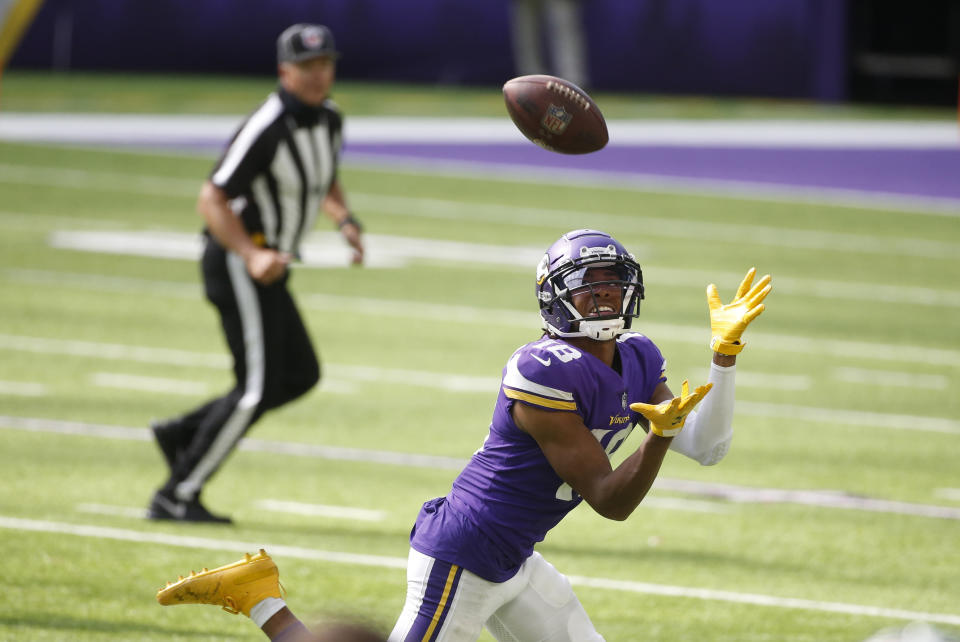 Minnesota Vikings wide receiver Justin Jefferson catches a 71-yard touchdown pass during the second half of an NFL football game against the Tennessee Titans, Sunday, Sept. 27, 2020, in Minneapolis. (AP Photo/Bruce Kluckhohn)