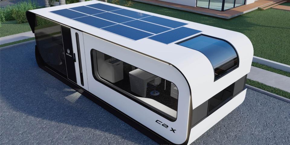 exterior of the one-bedroom Cube Two X with solar panels on the roof