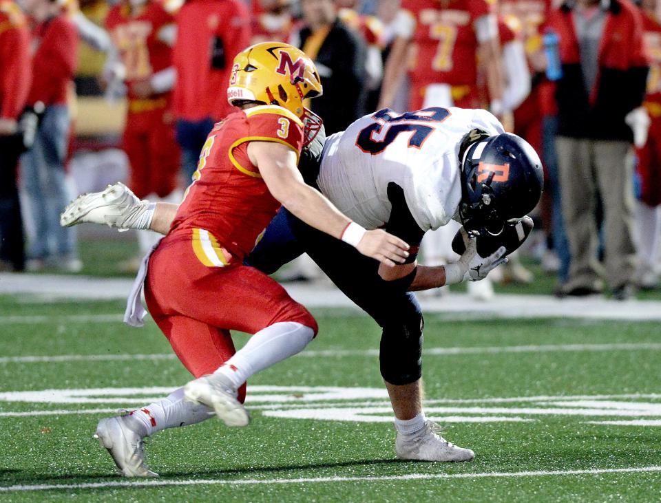 Rochester's Jack Swaney picks up the ball after blocking a punt during the game against Murphysboro Saturday, Nov. 18, 2023