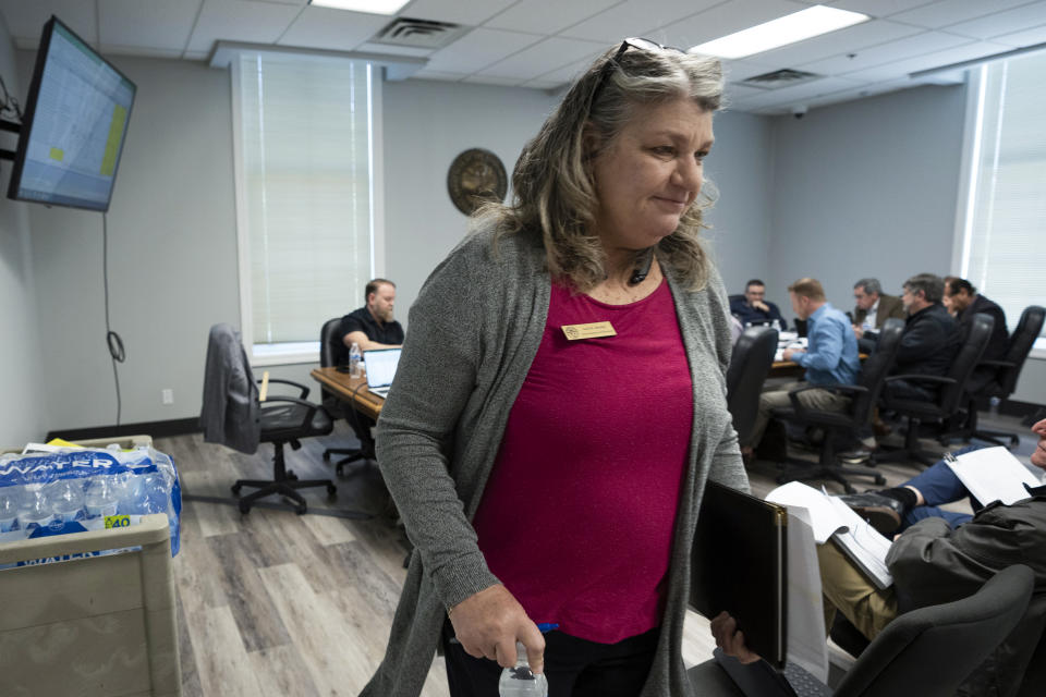 Sumner County Administrator of Elections Lori Atchley leaves a county commission budget committee meeting after presenting her department's proposed budget on Thursday, May 4, 2023, in Gallatin, Tenn. (AP Photo/George Walker IV)