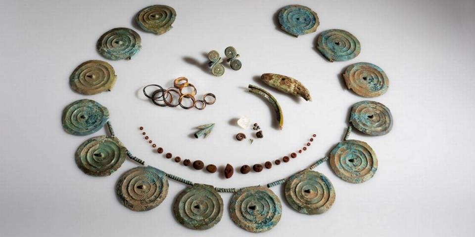 The 3,500-year-old jewelry set including spike discs, gold spirals, rings, beads and an arrowhead.