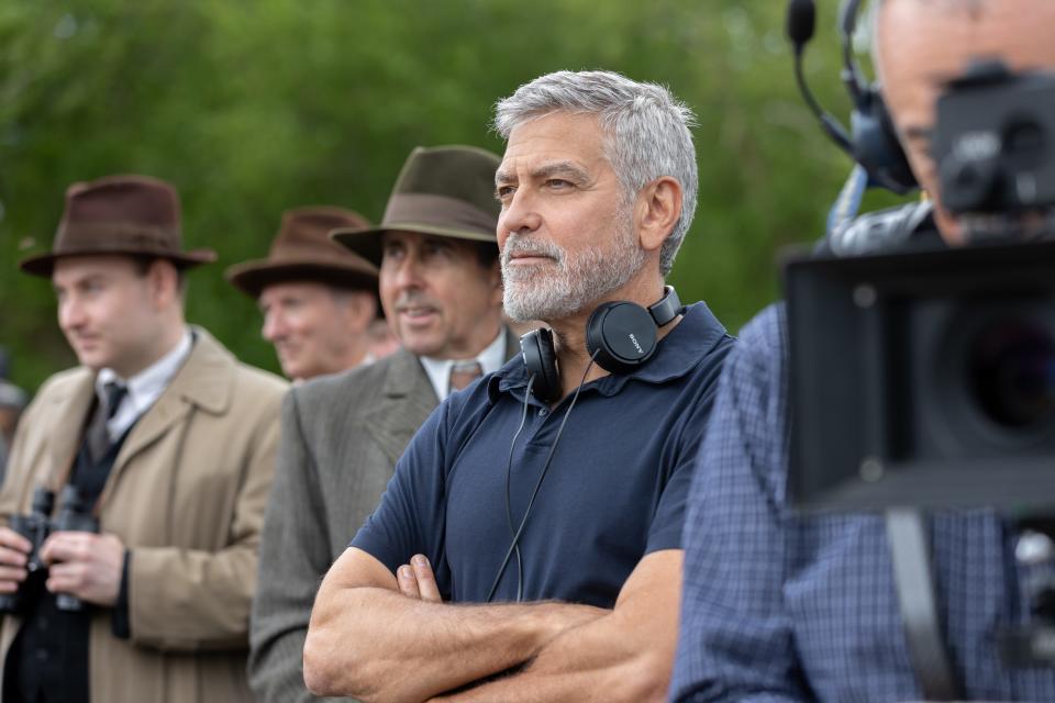 With "The Boys in the Boat," director George Clooney (center) wanted another shot at a sports movie – and specifically aimed to make an "exciting" rowing film.