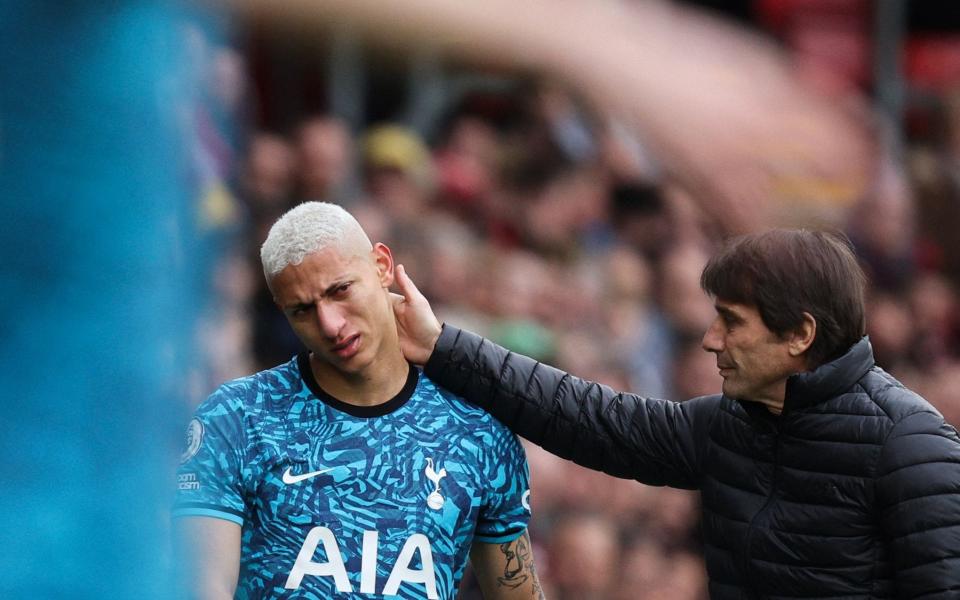 Tottenham Hotspur's Brazilian striker Richarlison (C) is conforted by Tottenham Hotspur's Italian head coach Antonio Conte - Getty Images/Adrian Dennis