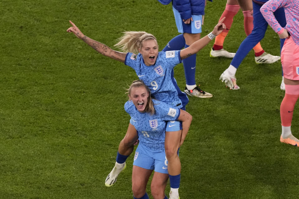 England's Rachel Daly and England's Georgia Stanway celebrate after the Women's World Cup semifinal soccer match between Australia and England at Stadium Australia in Sydney, Australia, Wednesday, Aug. 16, 2023. (AP Photo/Mark Baker)