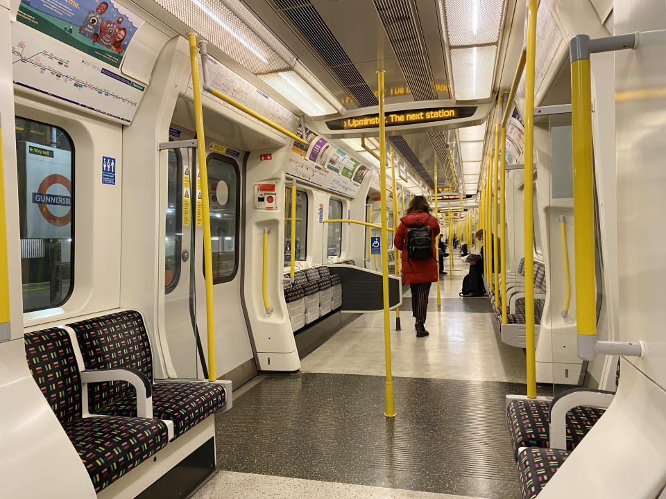 Empty seats on an early morning commuter train on the District Line, in west London, the morning after Prime Minister Boris Johnson announced that work-from-home guidance will return Monday as part of the introduction of new restrictions in England to help control the spread of the Omicron variant. Picture date: Thursday December 9, 2021.