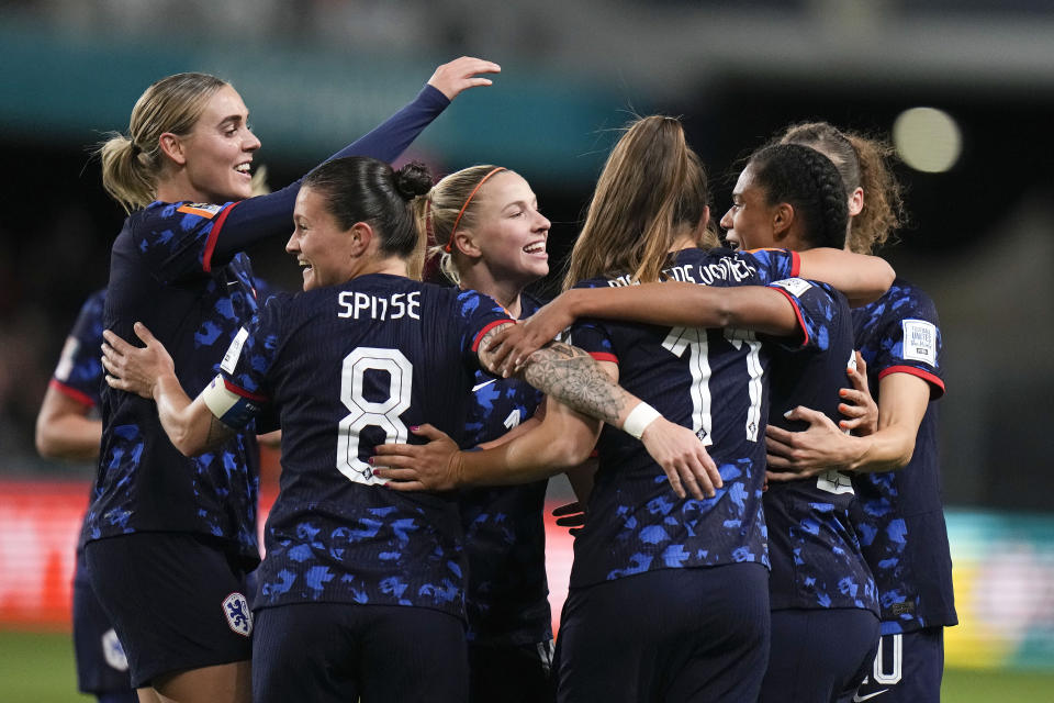 Netherlands' Esmee Brugts, right, is celebrated by her team after scoring the third goal during the Women's World Cup Group E soccer match between Vietnam and the Netherlands in Dunedin, New Zealand, Tuesday, Aug. 1, 2023. (AP Photo/Alessandra Tarantino)