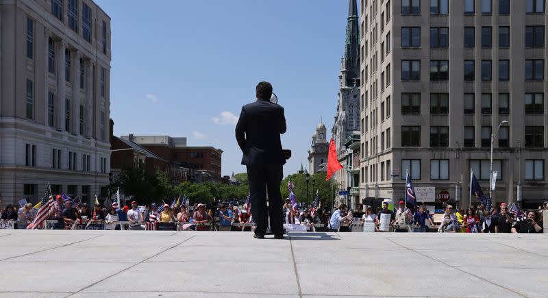 Protestors rally against the coronavirus disease (COVID-19) restrictions during a rally held outside the Pennsylvania State Capitol Building in Harrisburg, Pennsylvania