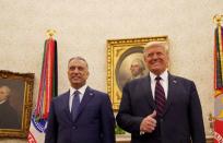 FILE PHOTO: U.S. President Donald Trump receives Iraq's Prime Minister Mustafa al-Kadhimi in the Oval Office at the White House in Washington