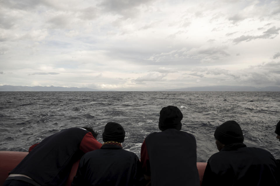 Migrants stand on the deck of the Ocean Viking rescue ship, in the Strait of Sicily, in the Mediterranean Sea, Saturday, Nov. 5, 2022. (AP Photo/Vincenzo Circosta)