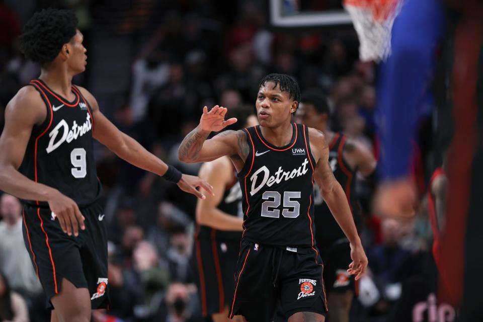 Detroit Pistons guard Marcus Sasser, right, celebrates with Ausar Thompson during the second half against the Portland Trail Blazers at Moda Center in Portland, Oregon, on Thursday, Feb. 8, 2024.